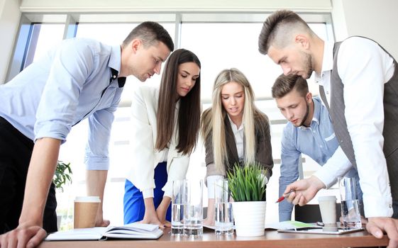 Business team discussing together business plans in office