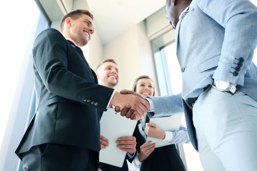 Business people shaking hands, finishing up a meeting