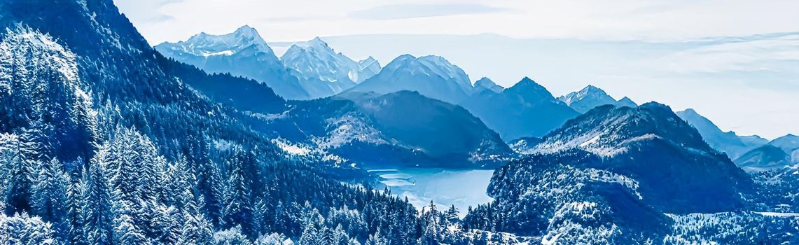 Winter wonderland and magical Christmas landscape. Snowy mountains and forest covered with snow as holiday background.