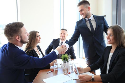 Business people shaking hands, finishing up a meeting