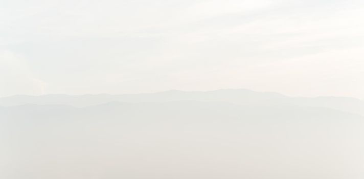 Misty mountains with sky horizon high quality photo
