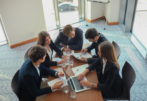 Business people discussing together in conference room during meeting at office