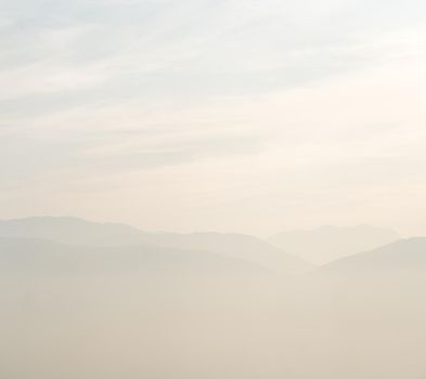 Misty mountains with sky horizon high quality photo