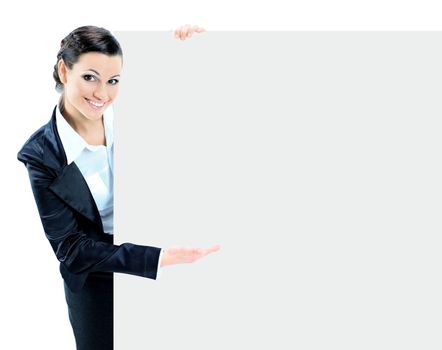 The girl with a big placard smiling and pointing to it with his hand. On a white background