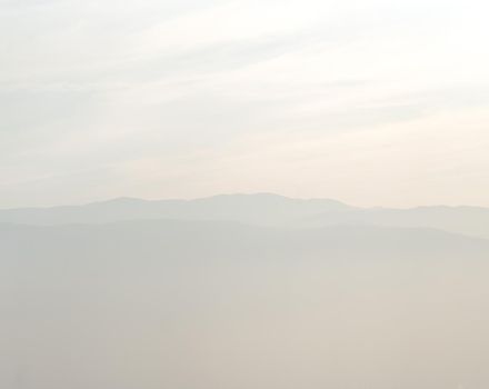 Misty mountains with sky horizon high quality photo