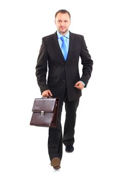 Portrait of a happy young business man carrying a suitcase on white background