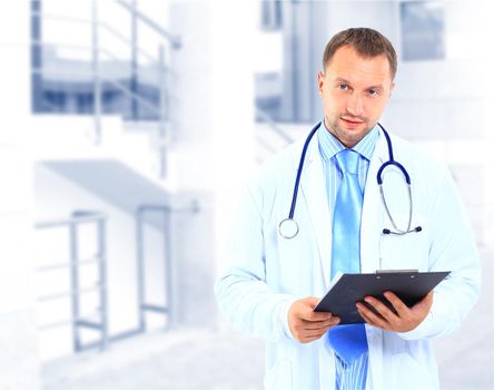 portrait of doctor in white coat and stethoscope with arms crossed