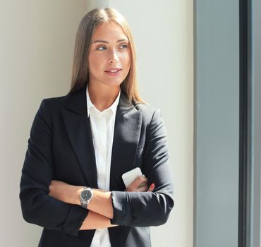 Modern business woman in the office with copy space