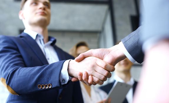 Business handshake. Business people shaking hands, finishing up a meeting