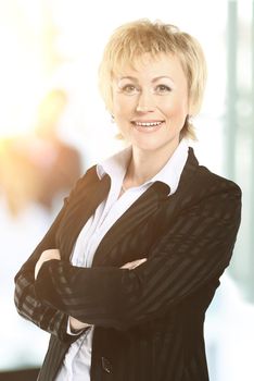 confident business woman with team behind her