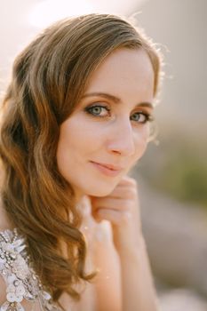 Smiling face of the fair-haired bride. Close-up. High quality photo