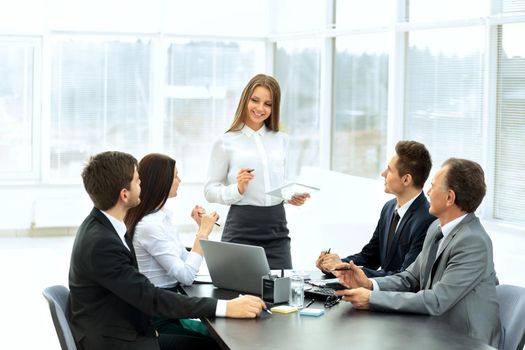 successful business team discussing a work plan for the work, she serves on the planning meeting manager