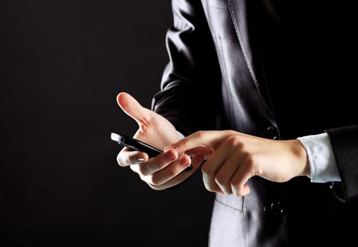 Young businessman working with modern devices, digital tablet computer and mobile phone.