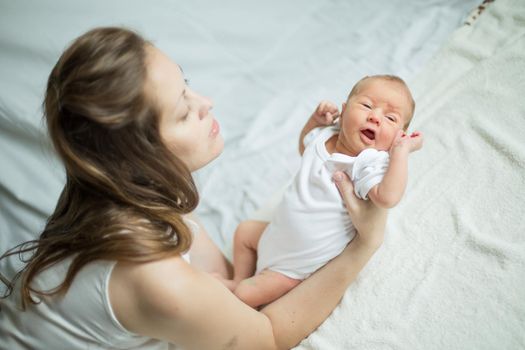 mother with her newborn baby .the photo has a empty space for your text