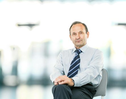 portrait - lawyer consultant sitting in my Desk chair on light blurred background photo has an empty space for your text