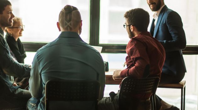 successful, multinational business team brainstorms in the workplace in a modern office.