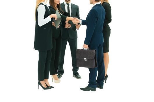 in the foreground: business partners shaking hands at the meeting. isolated on white background