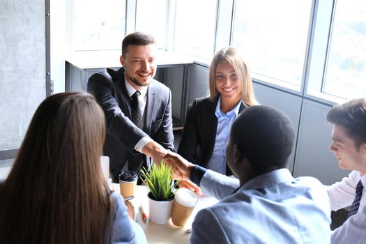 Business handshake. Business people shaking hands, finishing up a meeting