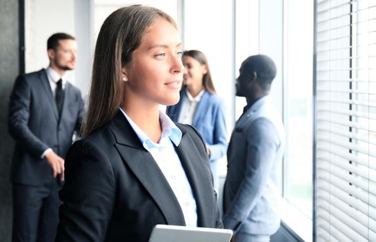 Face of beautiful woman on the background of business people