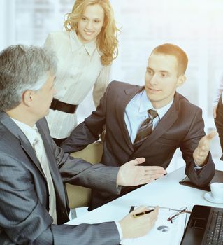 A group of businessmen discussing the policy of the company the office.