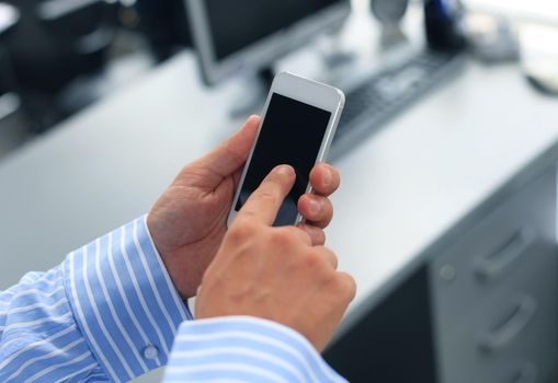 Close up of a man using mobile smart phone