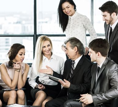 A group of businessmen discussing the policy of the company in the office.
