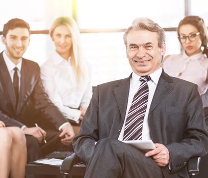 A group of businessmen discussing the policy of the company in office.