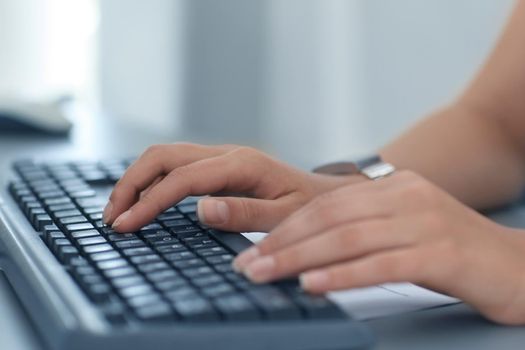 Close-up Of Female Hand Typing On Keyboard
