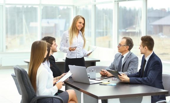 A group of businessmen discussing the policy of the company the office.