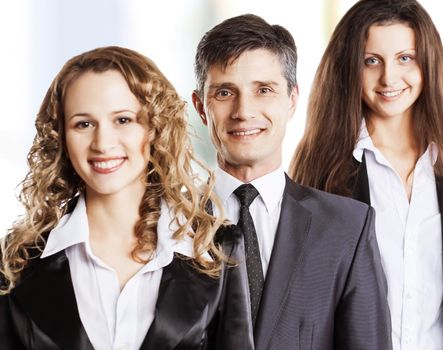 Group portrait of a professional business team looking confidently at camera