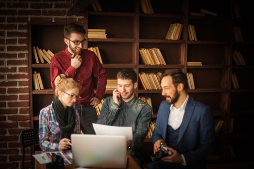 team of designers to develop new color palette in the workplace in a modern office
