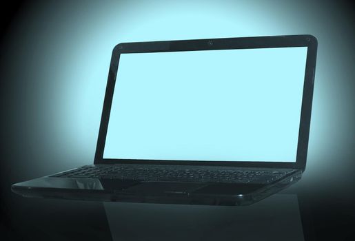 black laptop on black background with reflection