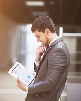 young businessman with a tablet pc, at the office