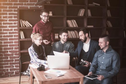 positive creative team of copywriters in the workplace in a modern office