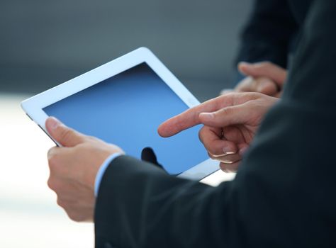 businessman holding digital tablet in office