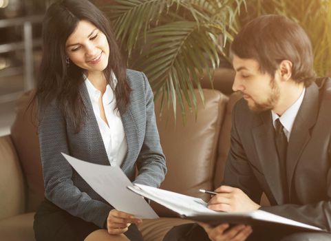 Businessman And Businesswoman Meeting In Modern Office