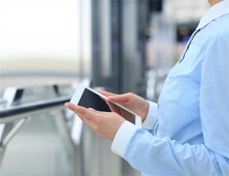 Business woman working with a digital tablet at modern office