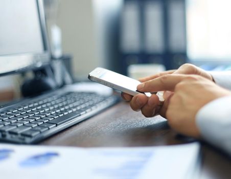 Close up of a business woman using mobile smart phone