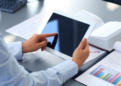 Businesswoman holding digital tablet