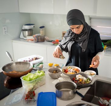 Woman in kitchen preparing the healthy organic food