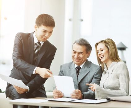 successful business team discussing a plan of the company in the office