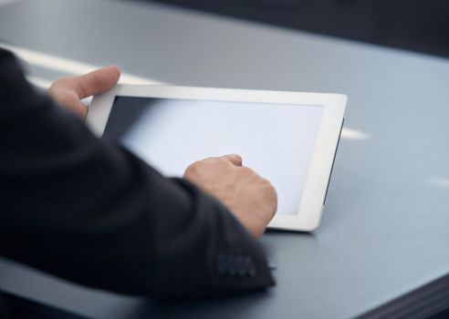 businessman holding digital tablet in office