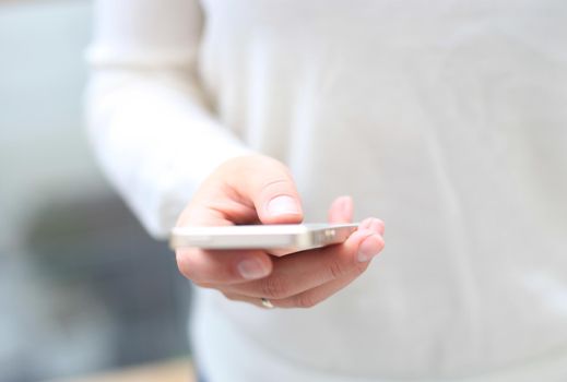 Close up of a woman using mobile smart phone