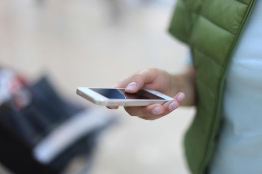 Close up of a woman using mobile smart phone