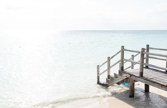 Beautiful tropical steps into turquoise sea water