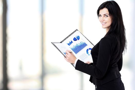 Smiling business woman holding document in the clipboard.