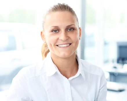 Closeup portrait of cute young business woman smiling