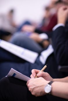 young people taking notes on education training  business seminar at modern conference room