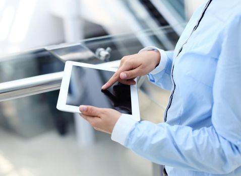 Business woman working with a digital tablet at modern office