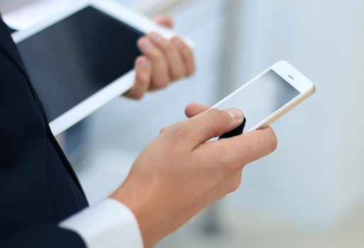 businessman working with modern devices, digital tablet computer and mobile phone